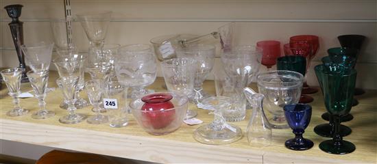 A collection of 19th century glassware including firing glasses, coloured wines and a ladle	